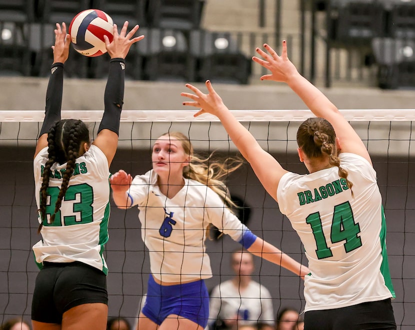 Southlake Carroll's Vanessa Glenn (83) gets a block on Hebron's Marley Rogers (6) during a...