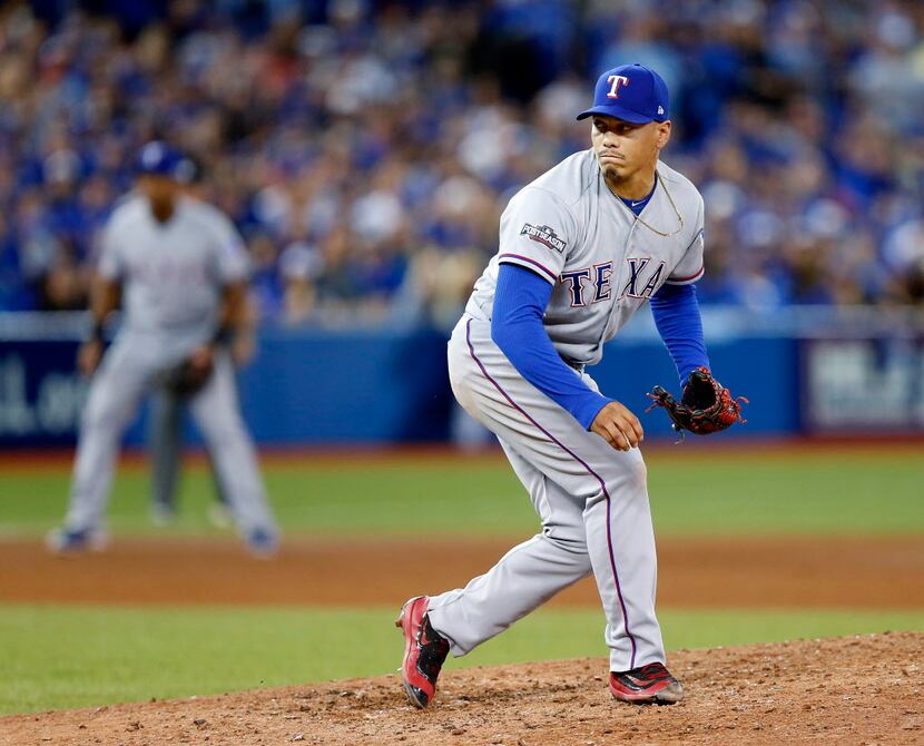 Texas Rangers relief pitcher Keone Kela (50) follwos through on a pitch against the Toronto...