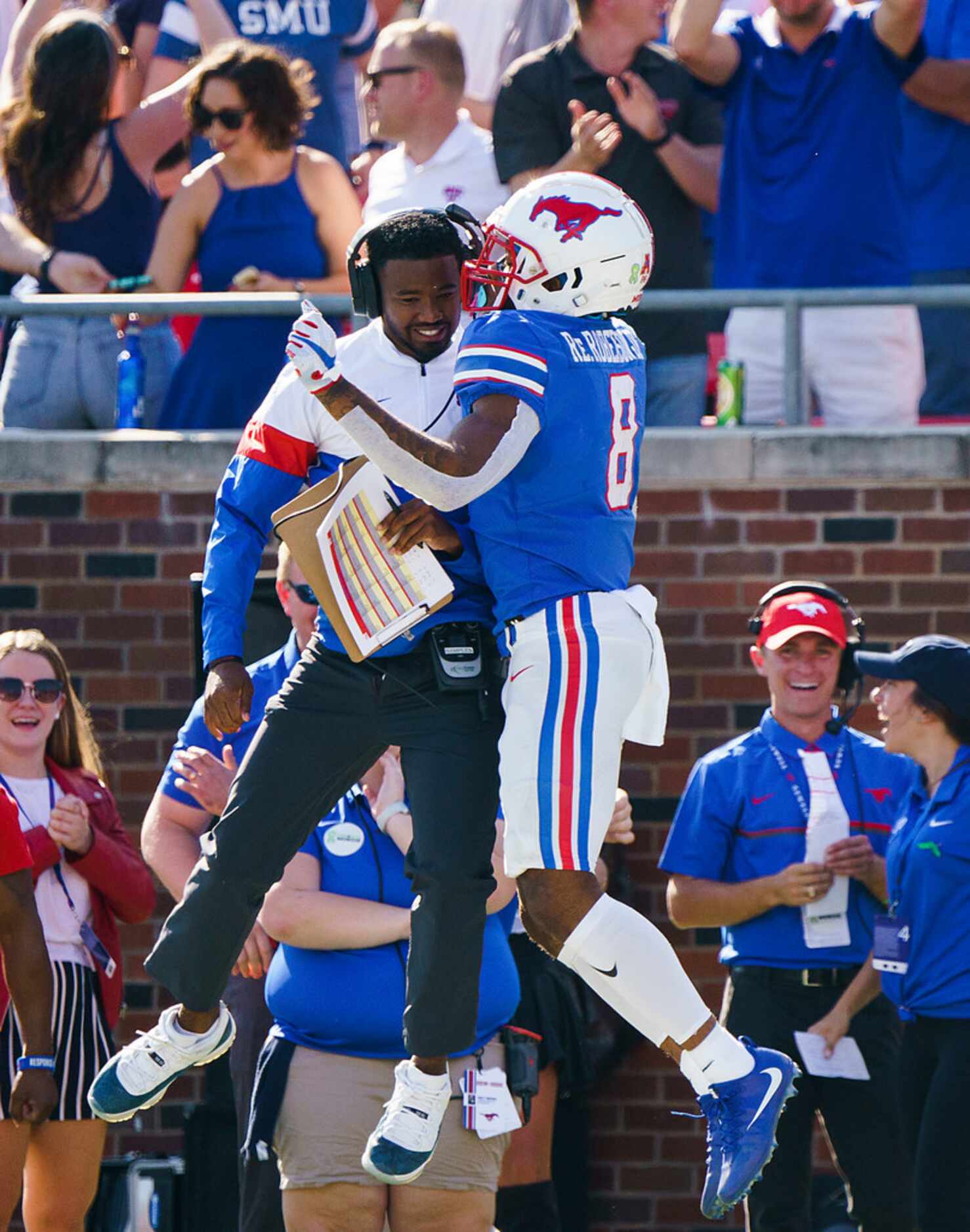 SMU wide receiver Reggie Roberson Jr. (8) celebrates on his way back to the bench after...