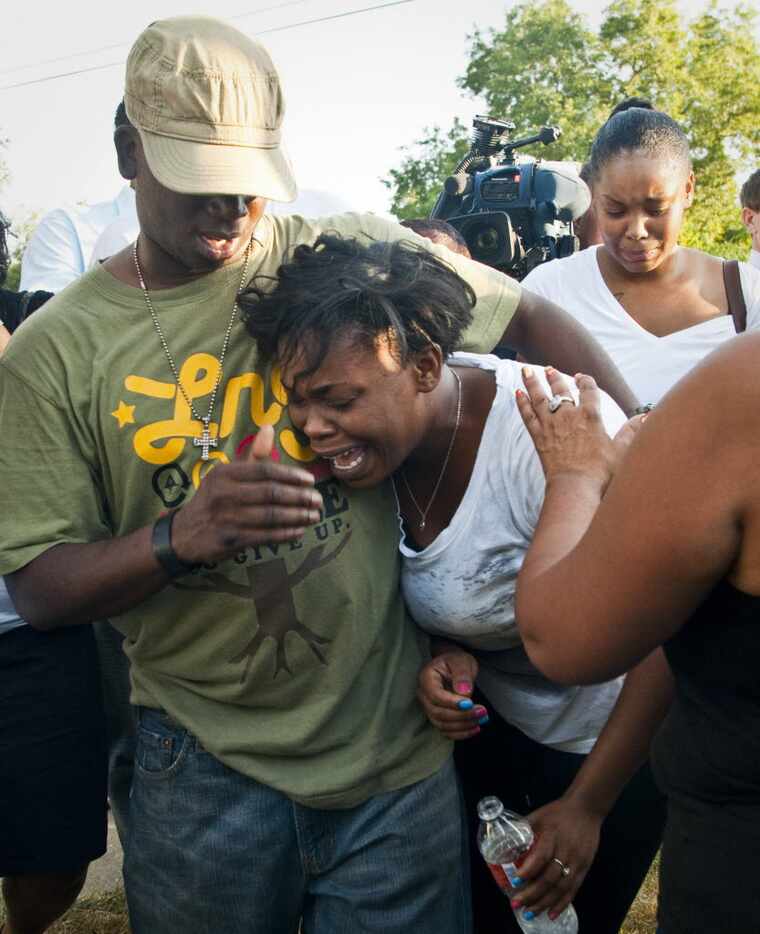 Tony Harper, brother of James Harper, embraced his sister Ashley Harper after they learned a...