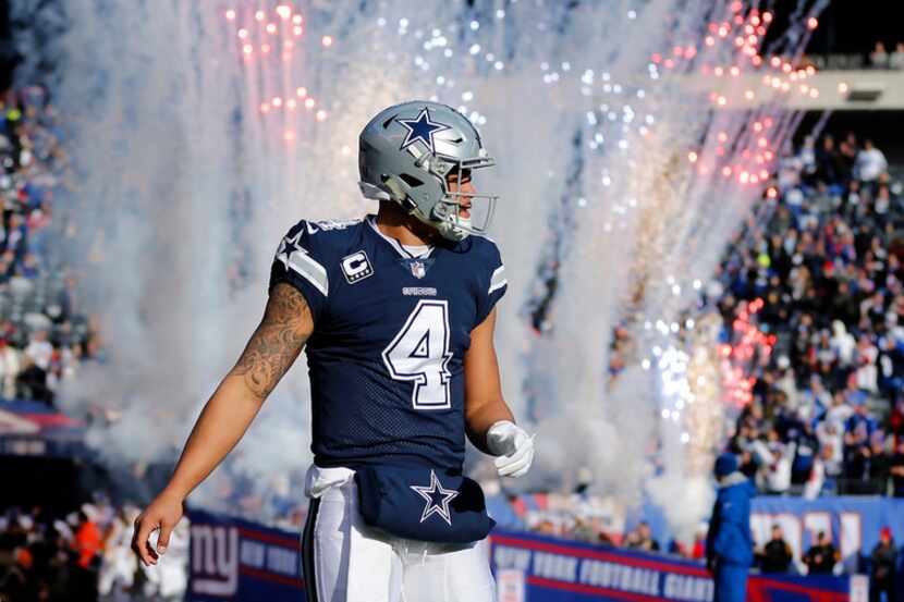 Fireworks go off behind Dallas Cowboys quarterback Dak Prescott (4) as the New York Giants...