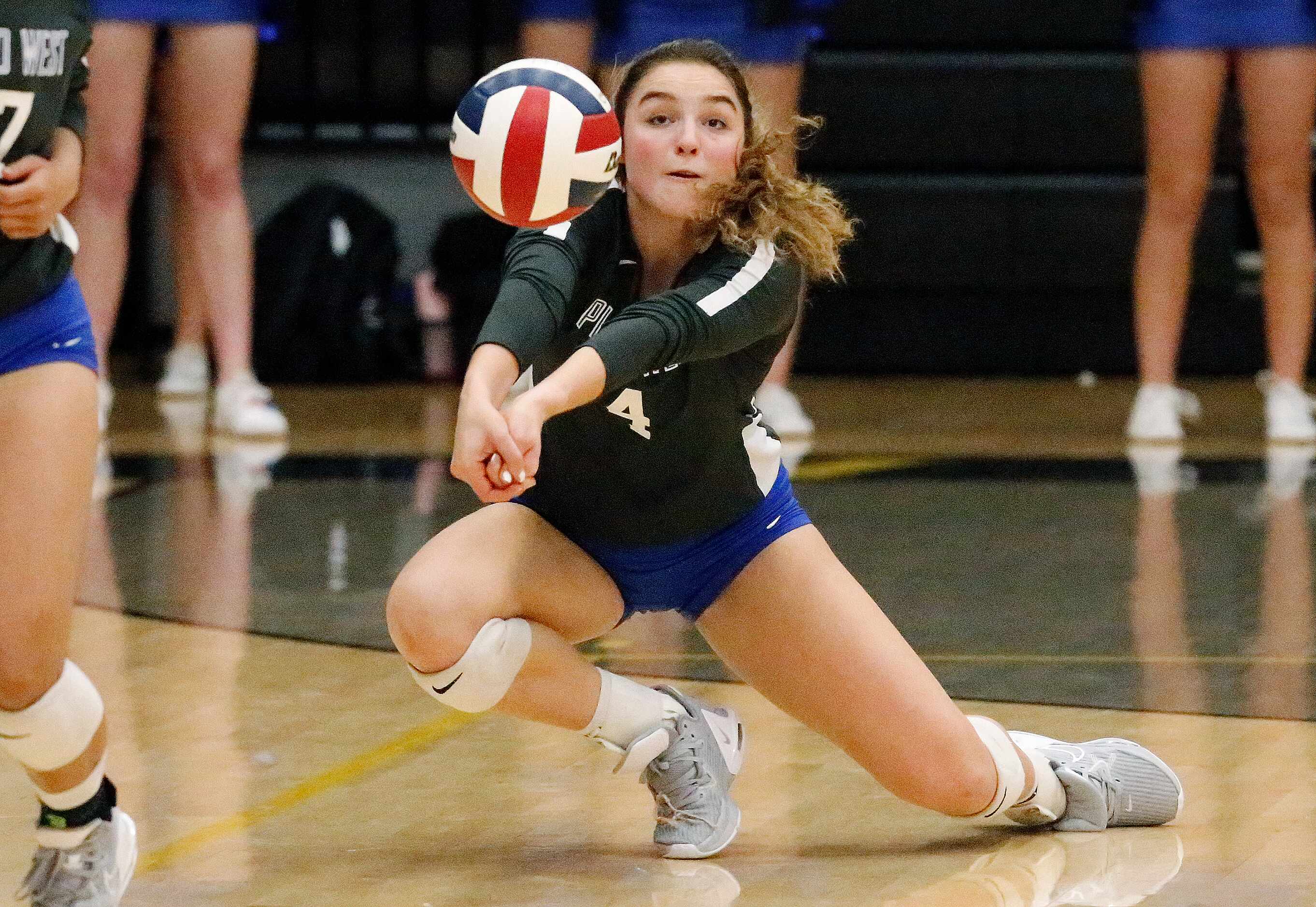Plano West High School outside hitter Katelyn Ruhman (4) receives a serve during game two as...