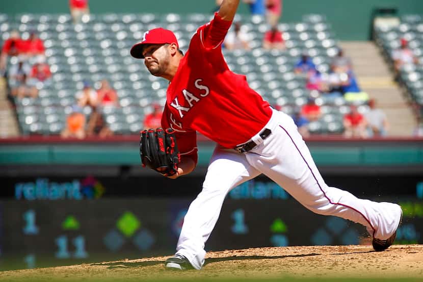 Texas Rangers starting pitcher Martin Perez (33) pitches in the ninth inning against the San...