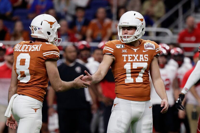 Texas place-kicker Cameron Dicker (17) celebrates his field goal with teammate Ryan...