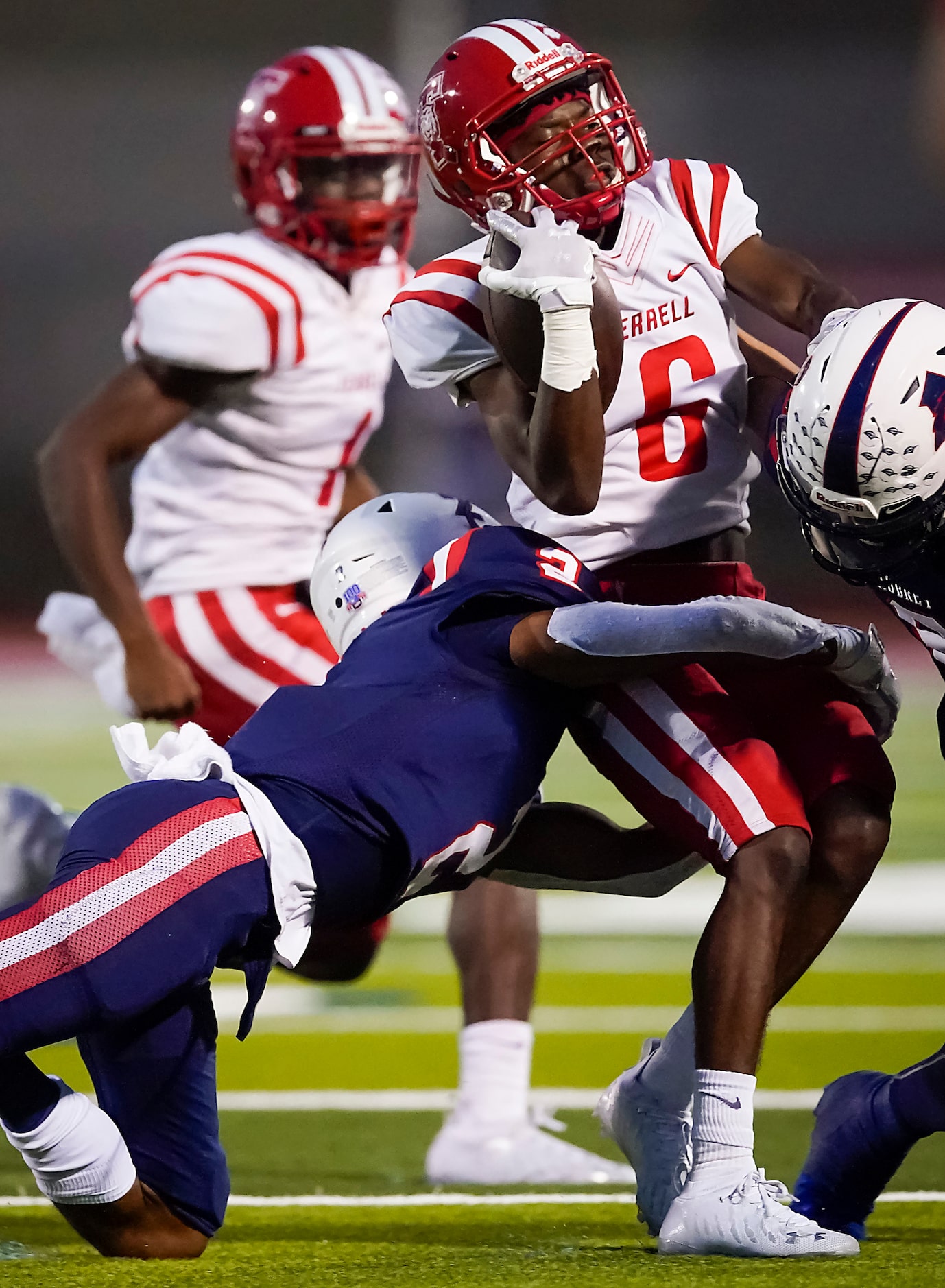 Terrell running back  Ta’nyrios Baker (6) is brought down by Aubrey defensive back J.J....