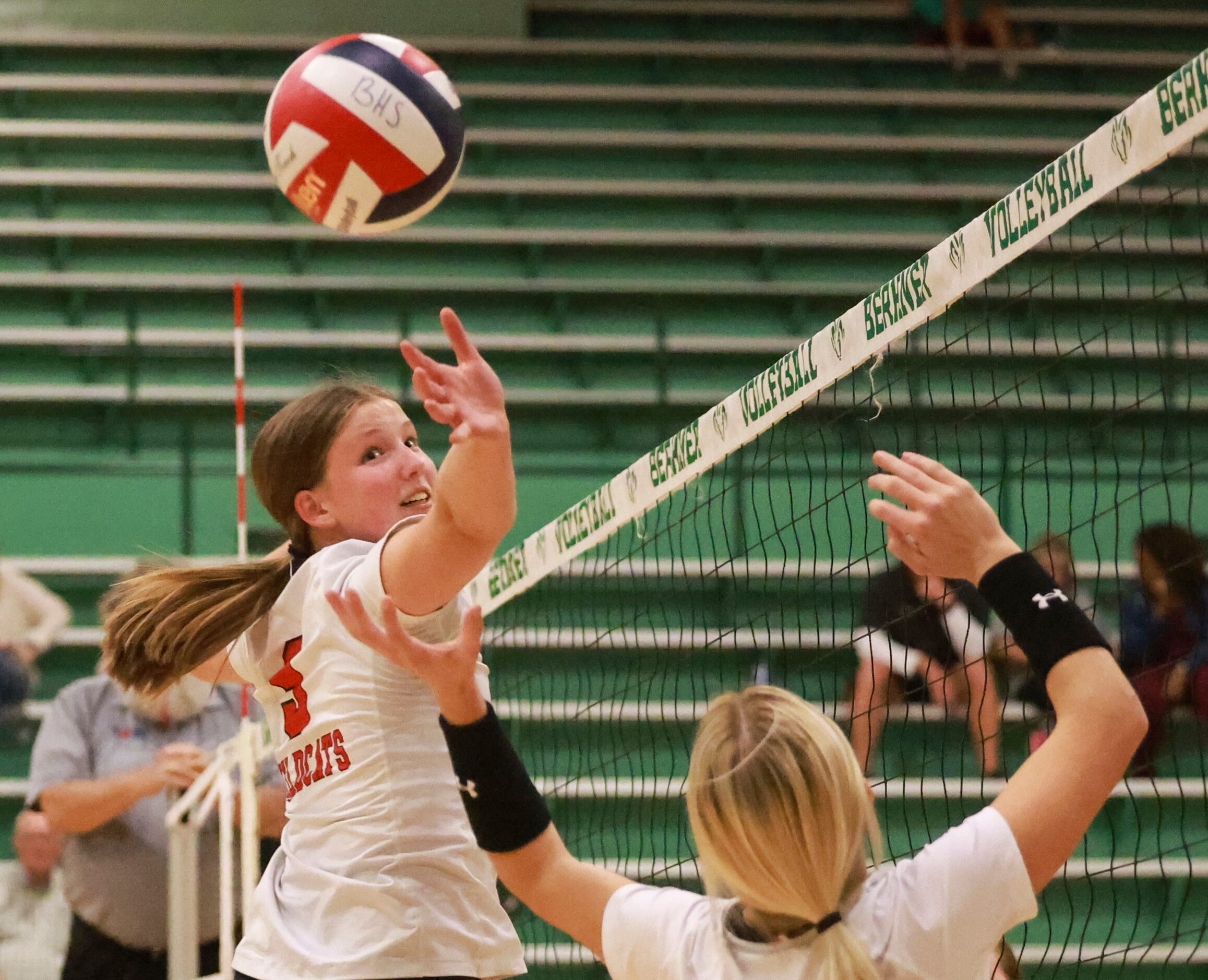 Lake Highlands High School Brynn Winburne (9) looks the ball as Miller McDonald (2) attempts...