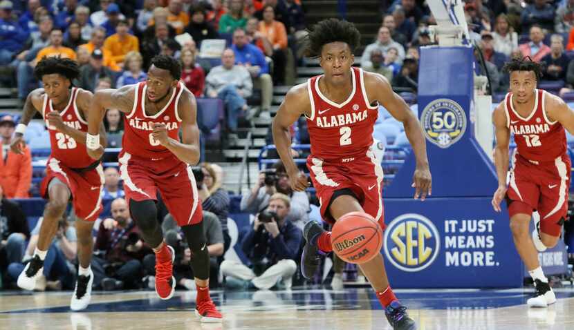 Alabama guard Collin Sexton leads a fast break in the second half during an SEC tournament...