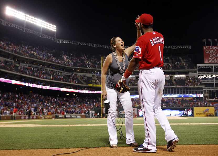 Texas Rangers shortstop Elvis Andrus (1) is congratulated on his 5-for-5 evening by Fox...