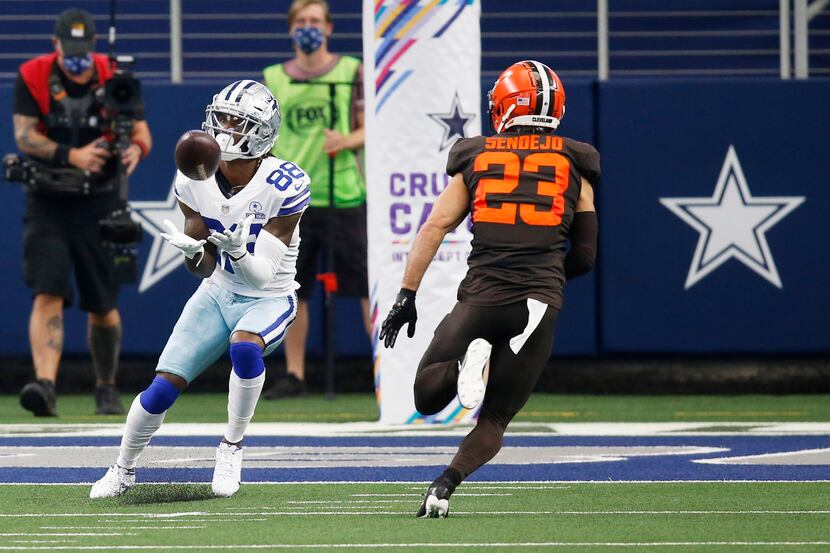 Dallas Cowboys wide receiver CeeDee Lamb (88) catches a pass for a touchdown in front of...