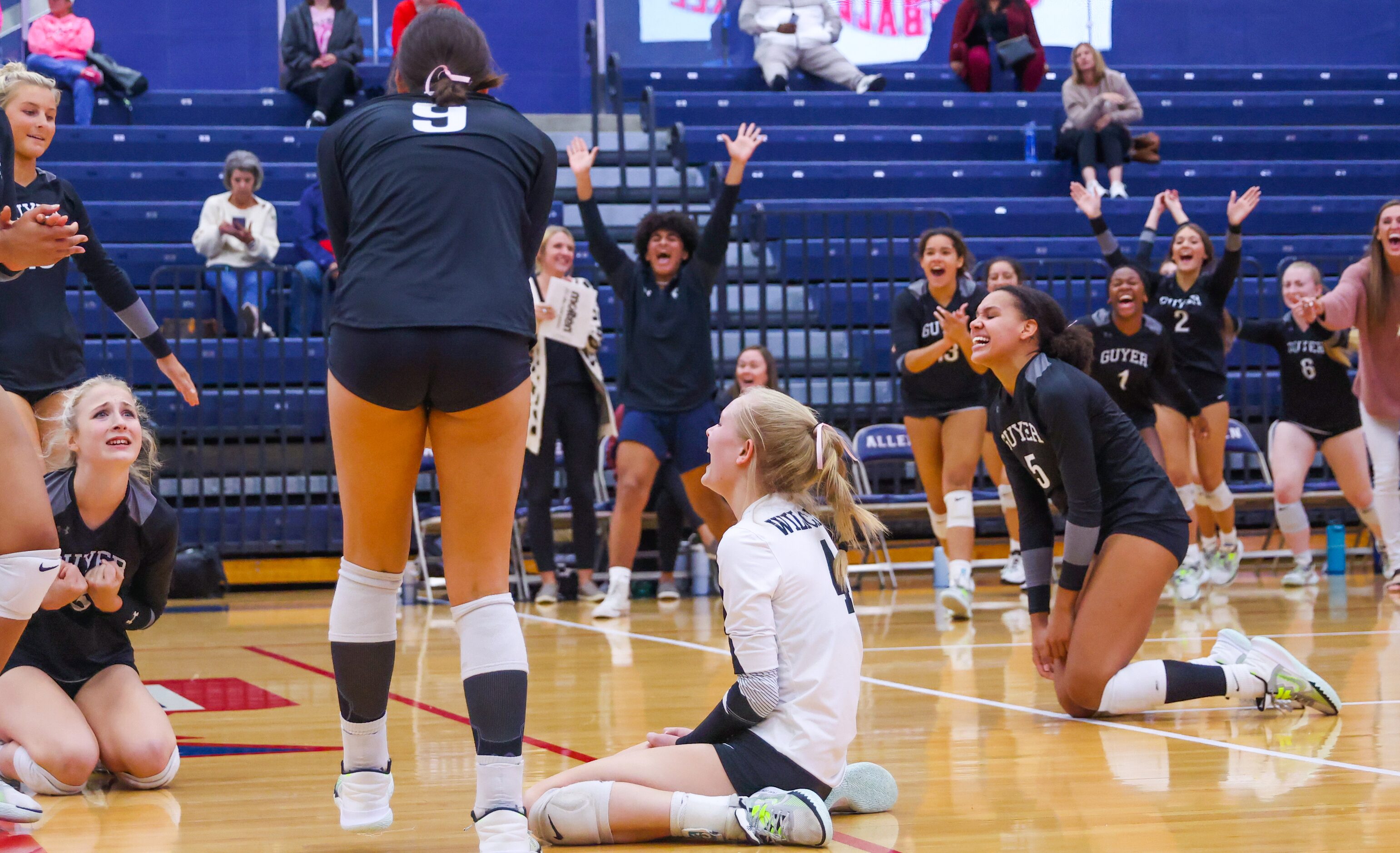 Denton Guyer players fall to their knees in celebration of senior Lauren Schneider’s (9)...