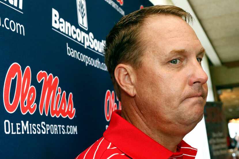 In this Tuesday, July 18, 2017 photo, Mississippi football coach Hugh Freeze considers a...