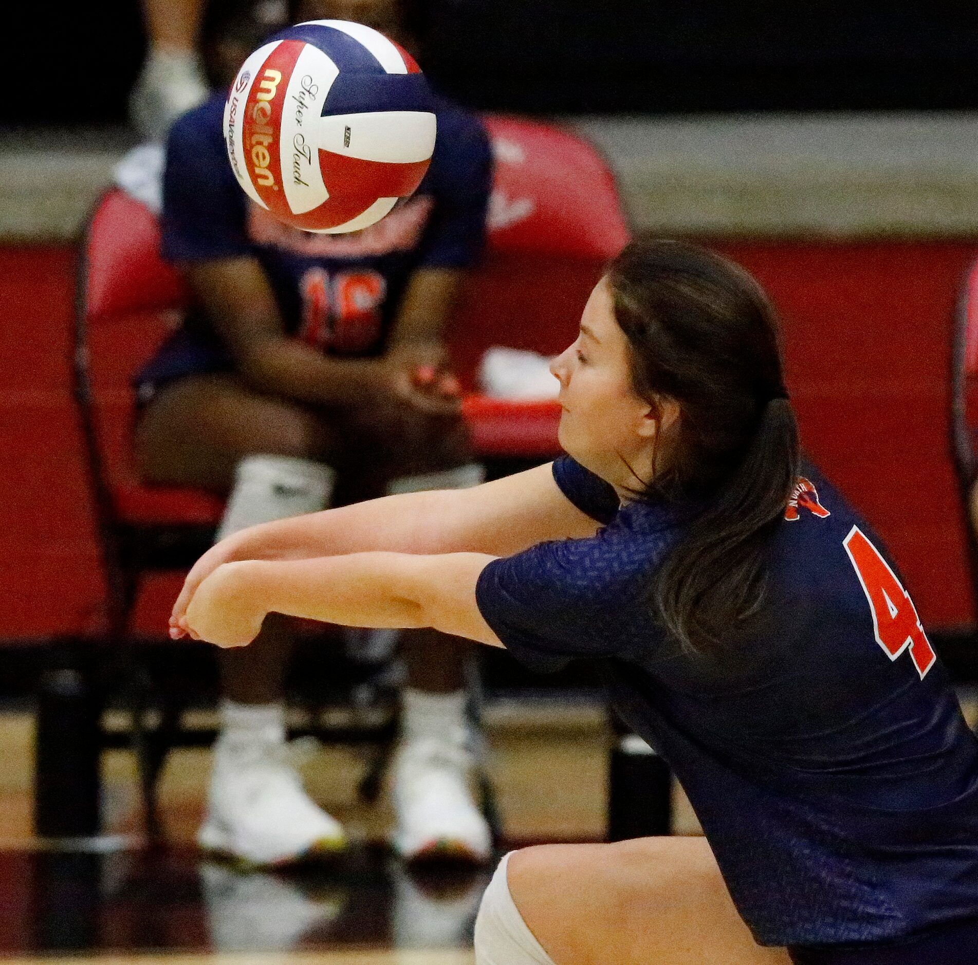 McKinney North High School defensive specialist Lauren Bass (4) makes a pass during game one...