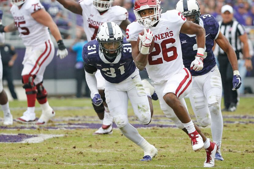 Oklahoma Sooners running back Kennedy Brooks (26) motors downfield on a long second-quarter...