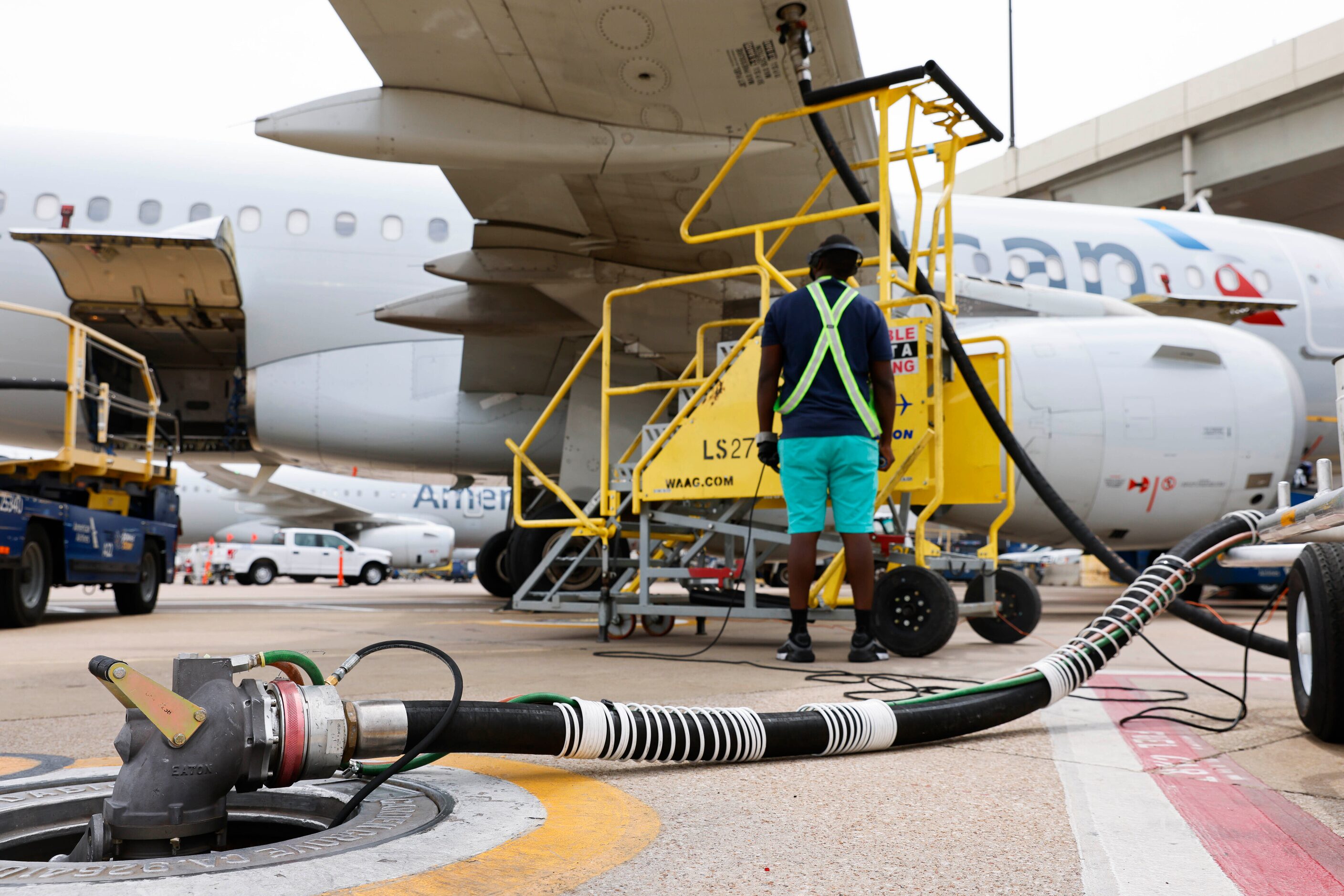 An American Airline flight enroute to Charleston, SC refuels at a gate of Terminal A on...