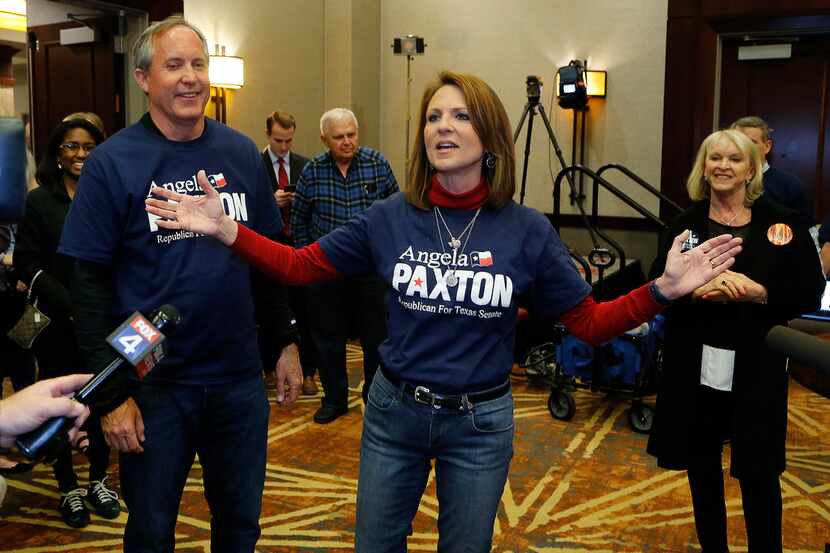 State Senate candidate Angela Paxton, center, appears with her husband, Attorney General Ken...