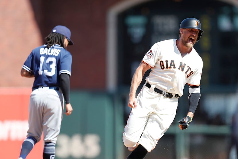 The San Francisco Giants' Hunter Pence celebrates his two-run double to beat the San Diego...