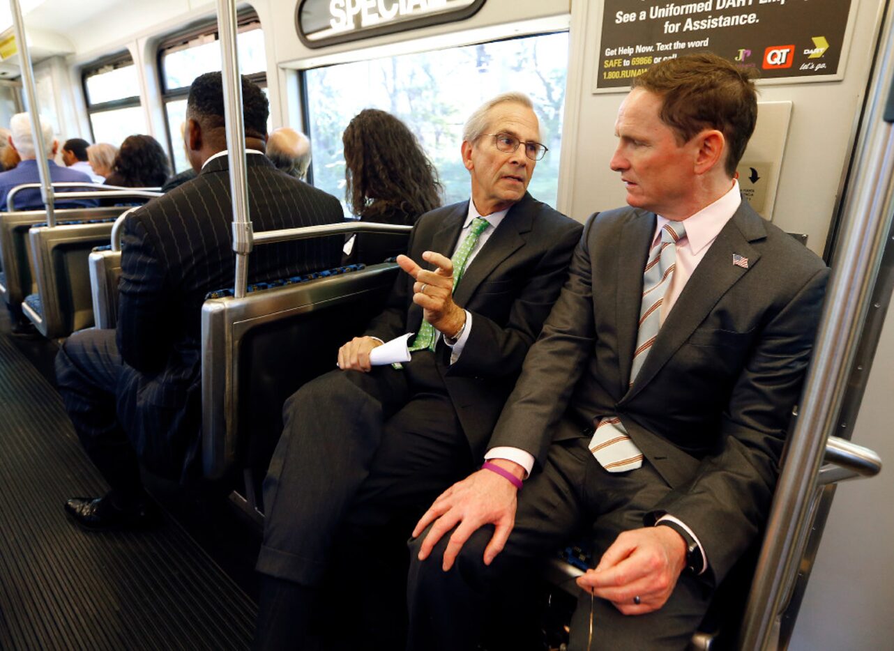 Dallas County Judge Clay Jenkins (right) visits with former Dallas County Judge and...