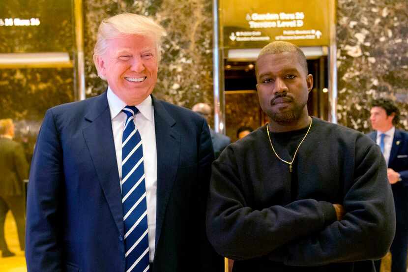 In this Dec. 13, 2016, file photo, then-President-elect Donald Trump and Kanye West pose for...