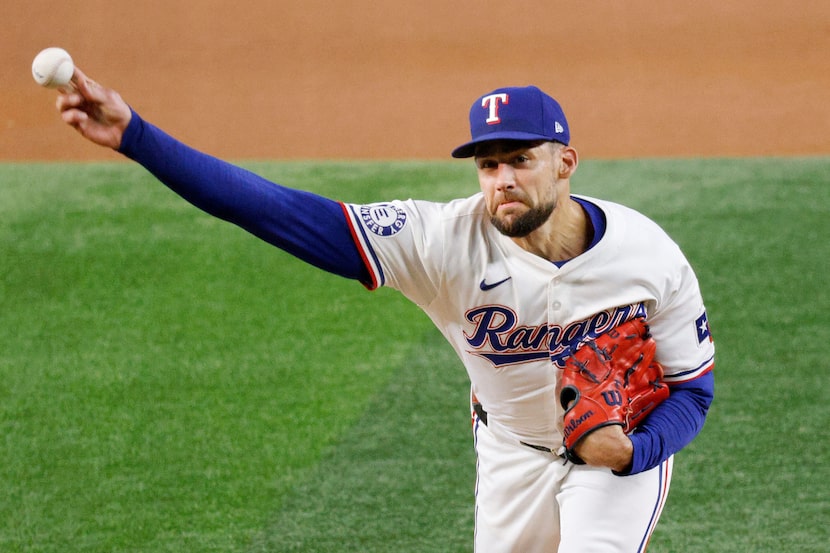 Texas Rangers pitcher Nathan Eovaldi (17) delivers during the first inning of a baseball...