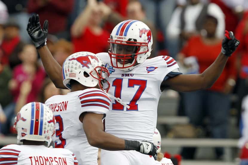 SMU wide receiver Jeremy Johnson (17) celebrates with wide receiver Darius Johnson (3) after...
