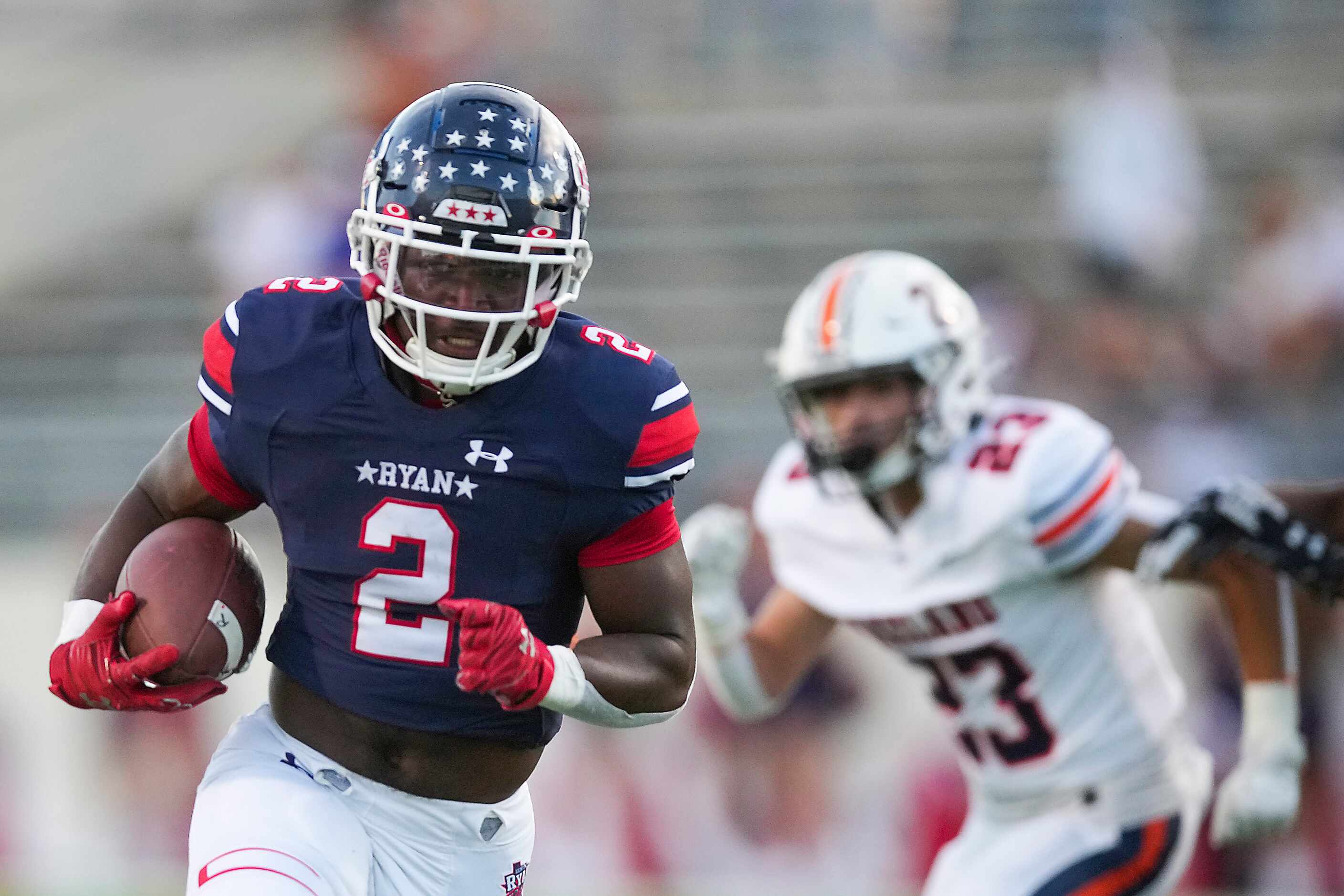 Denton Ryan running back Kalib Hicks (2) gets past Frisco Wakeland linebacker Garrett...