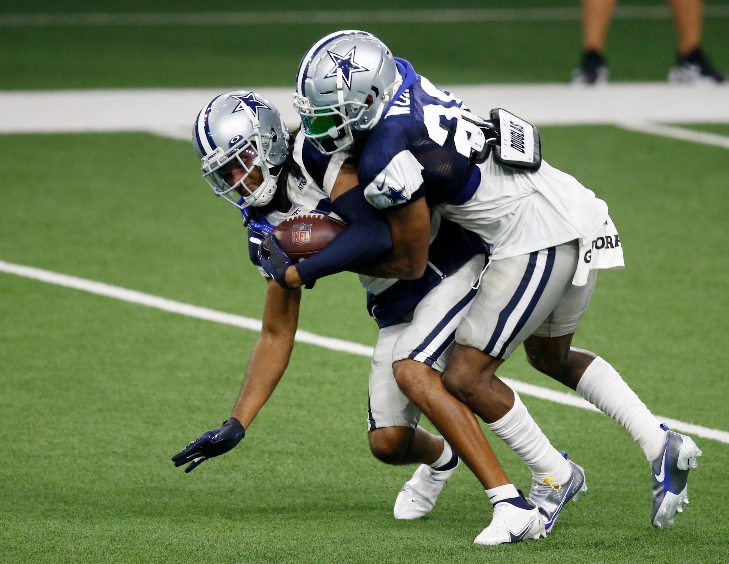 Dallas Cowboys wide receiver Ventell Bryant (83) is brought down by Dallas Cowboys...