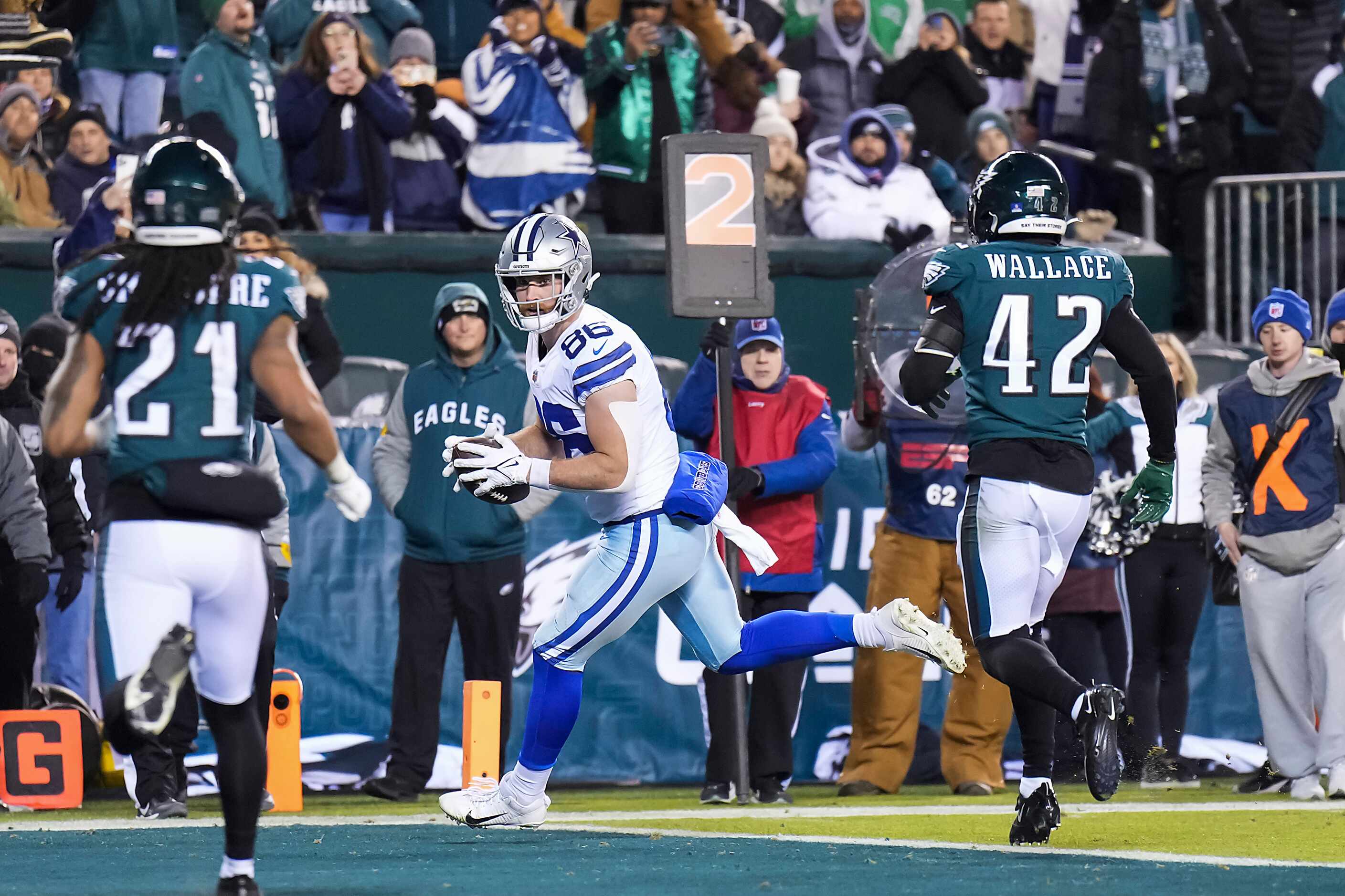 Dallas Cowboys safety Donovan Wilson (6) scores on a 2-yard touchdown catch past...