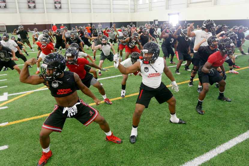 Players dance the Haka dance prior to Euless Trinity's first day of football practice at the...