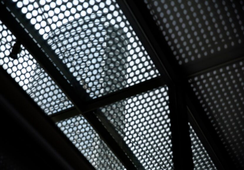 Museum Tower, as seen through the Nasher Sculpture Center's oculi pattern shaped roof in...