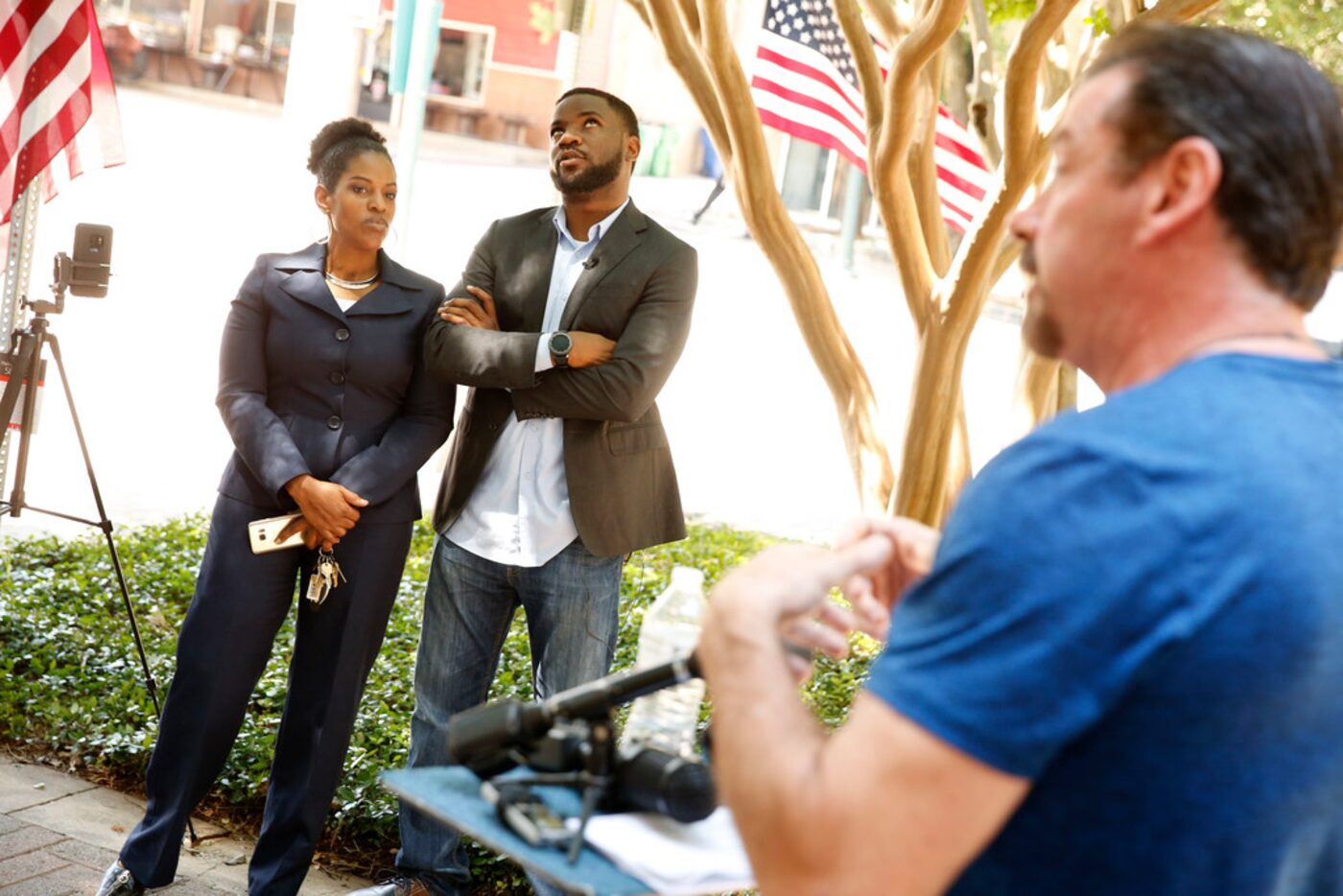 Dominique Alexander (center) and attorney Kim Cole listen as McKinney Mayor George Fuller...