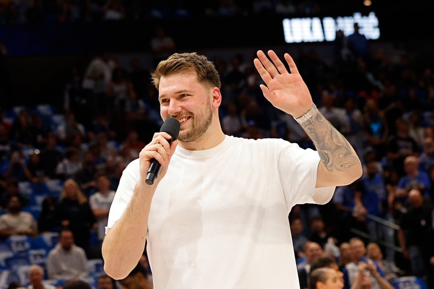 Dallas Mavericks guard Luka Doncic (77) waves before an NBA basketball game against the...