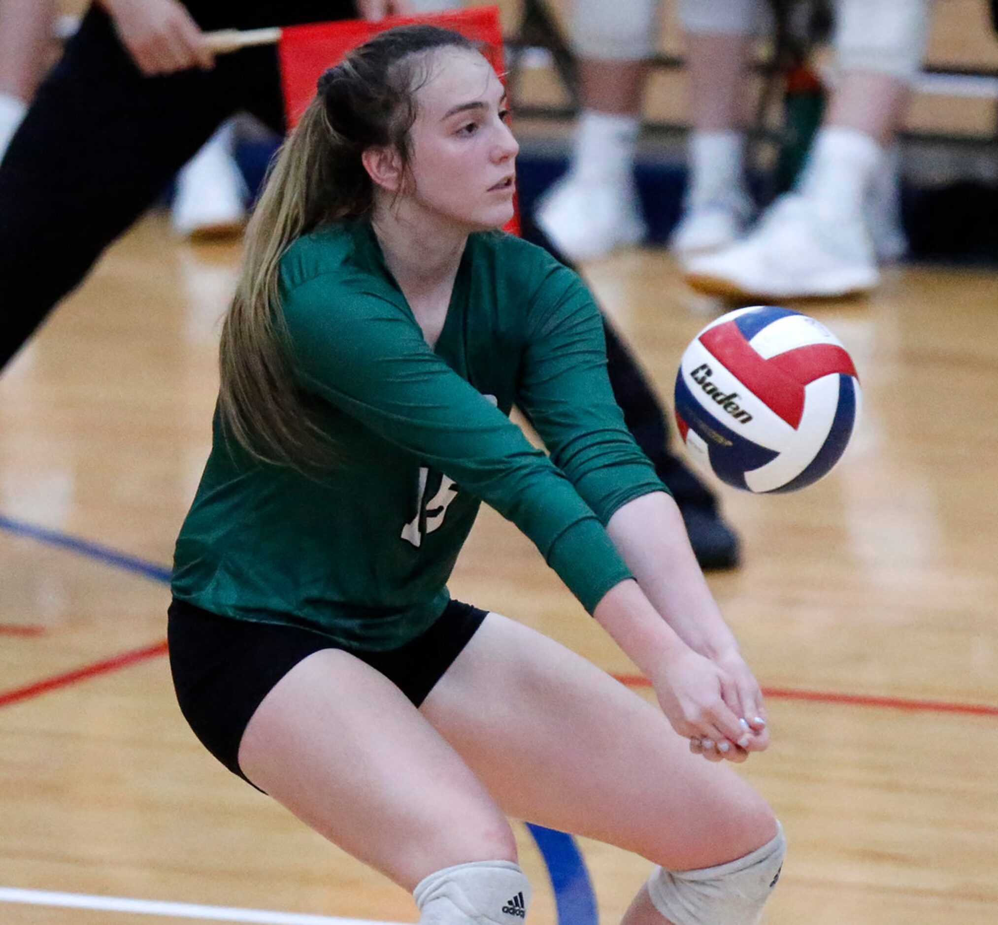 Prosper High School outside hitter Nikki Steinheiser (15) fields a serve during game two as...