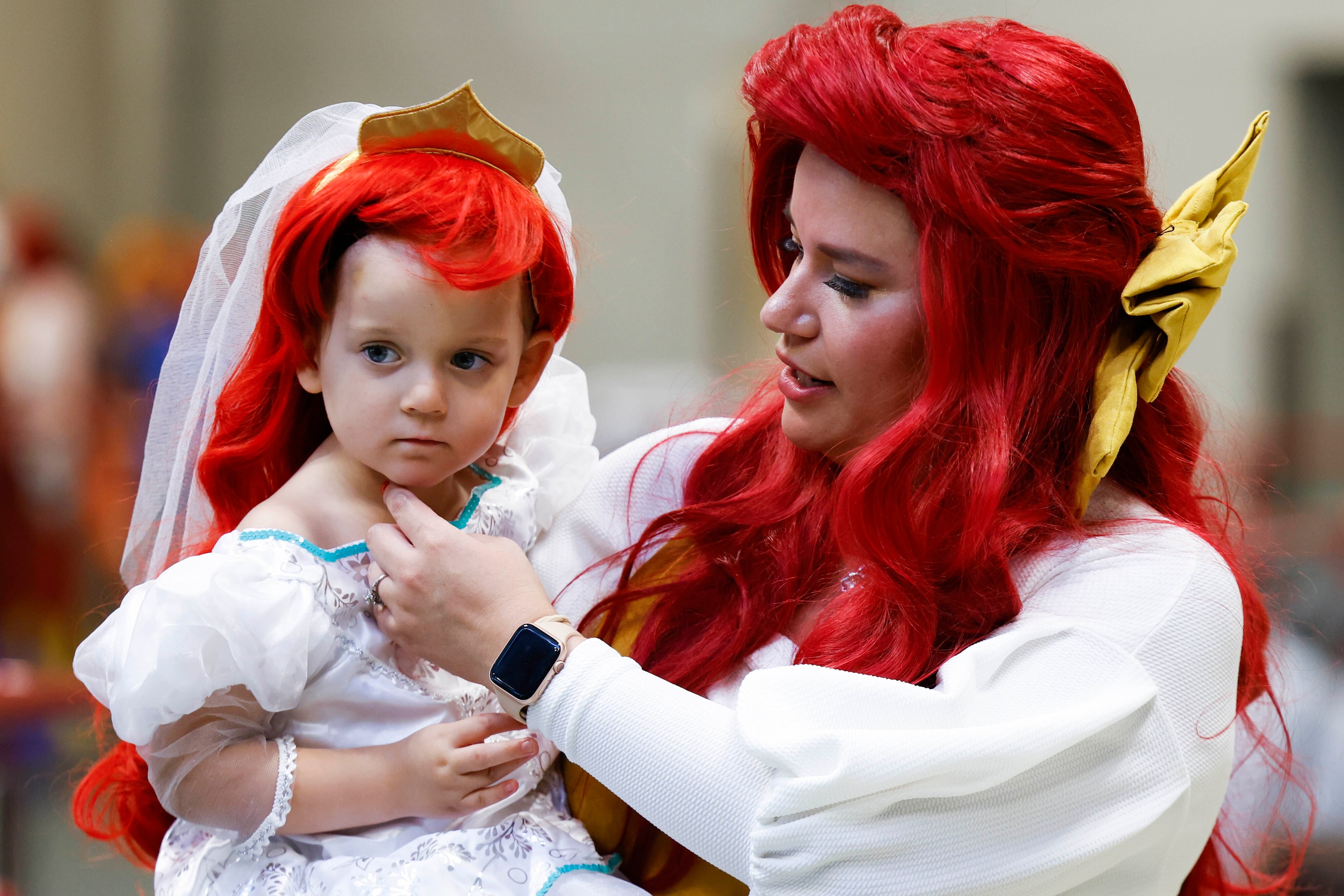 Amanda Blue and her daughter Aurora, 3, goes around Fan Expo Dallas on Friday, June 9, 2023,...