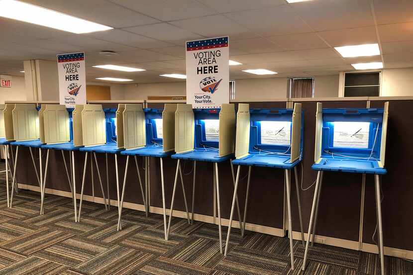 In this Sept. 20, 2018, photo, voting booths stood ready in downtown Minneapolis for the...