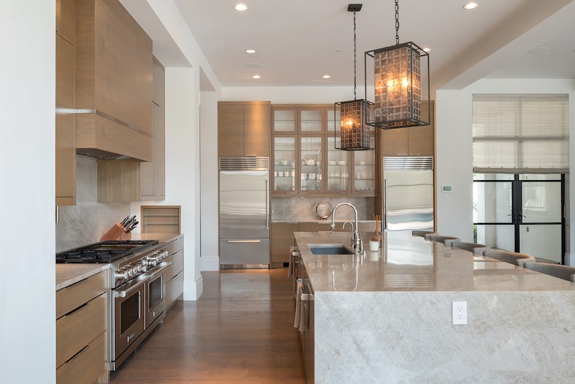 The design team sourced quartzite from Italy to craft the kitchen island.