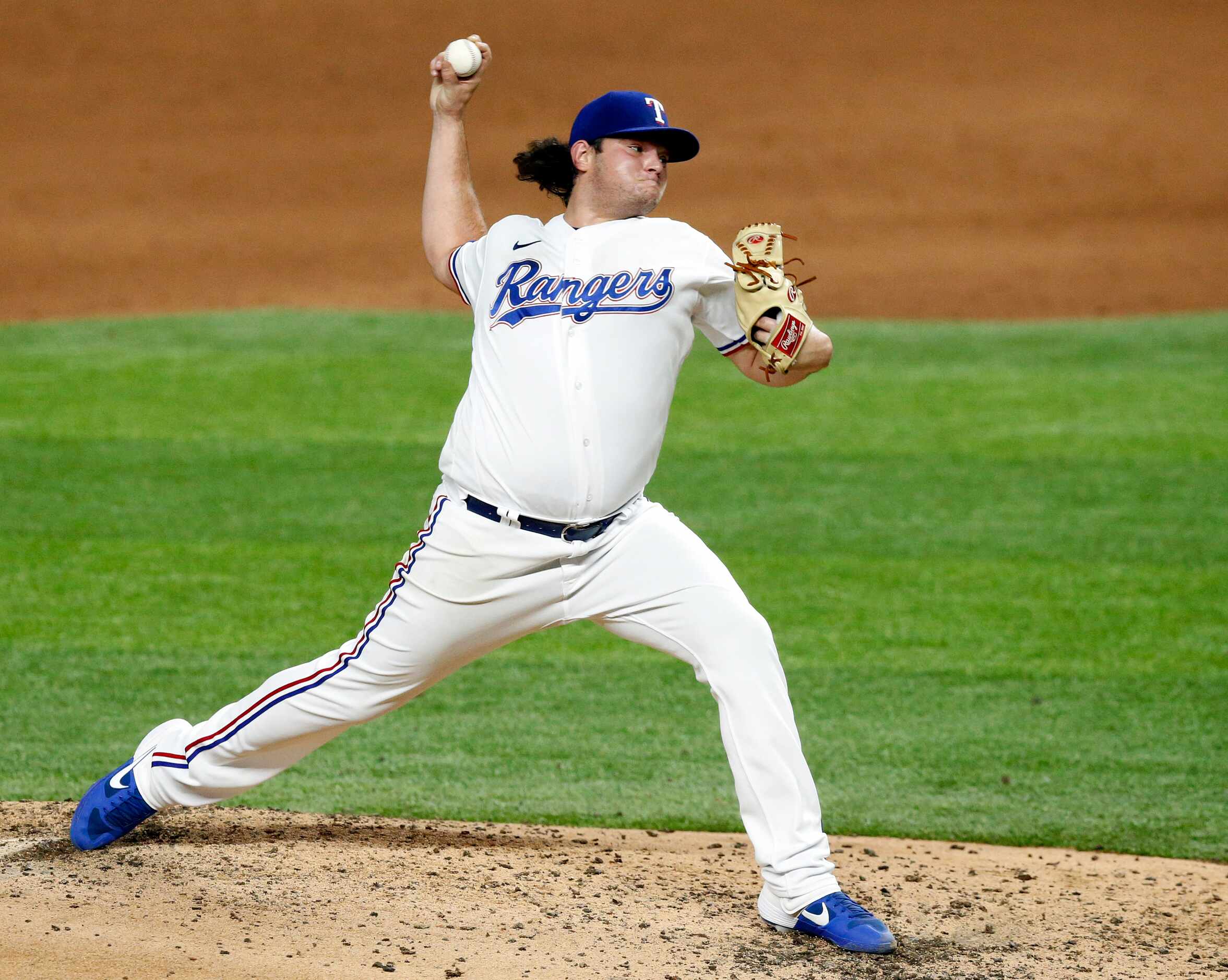 Texas Rangers relief pitcher Ian Gibaut (63) throws against the Arizona Diamondbacks during...