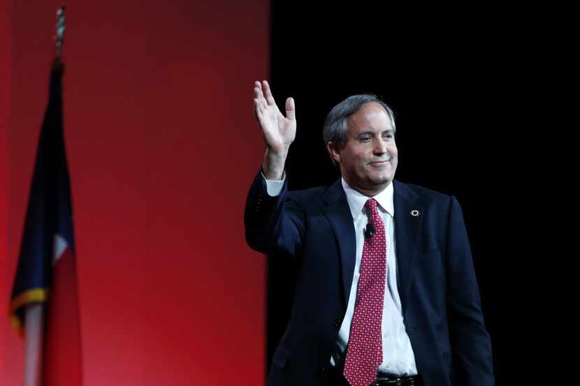 Texas Attorney General Ken Paxton, shown here waving to the crowd at the 2016 Texas...