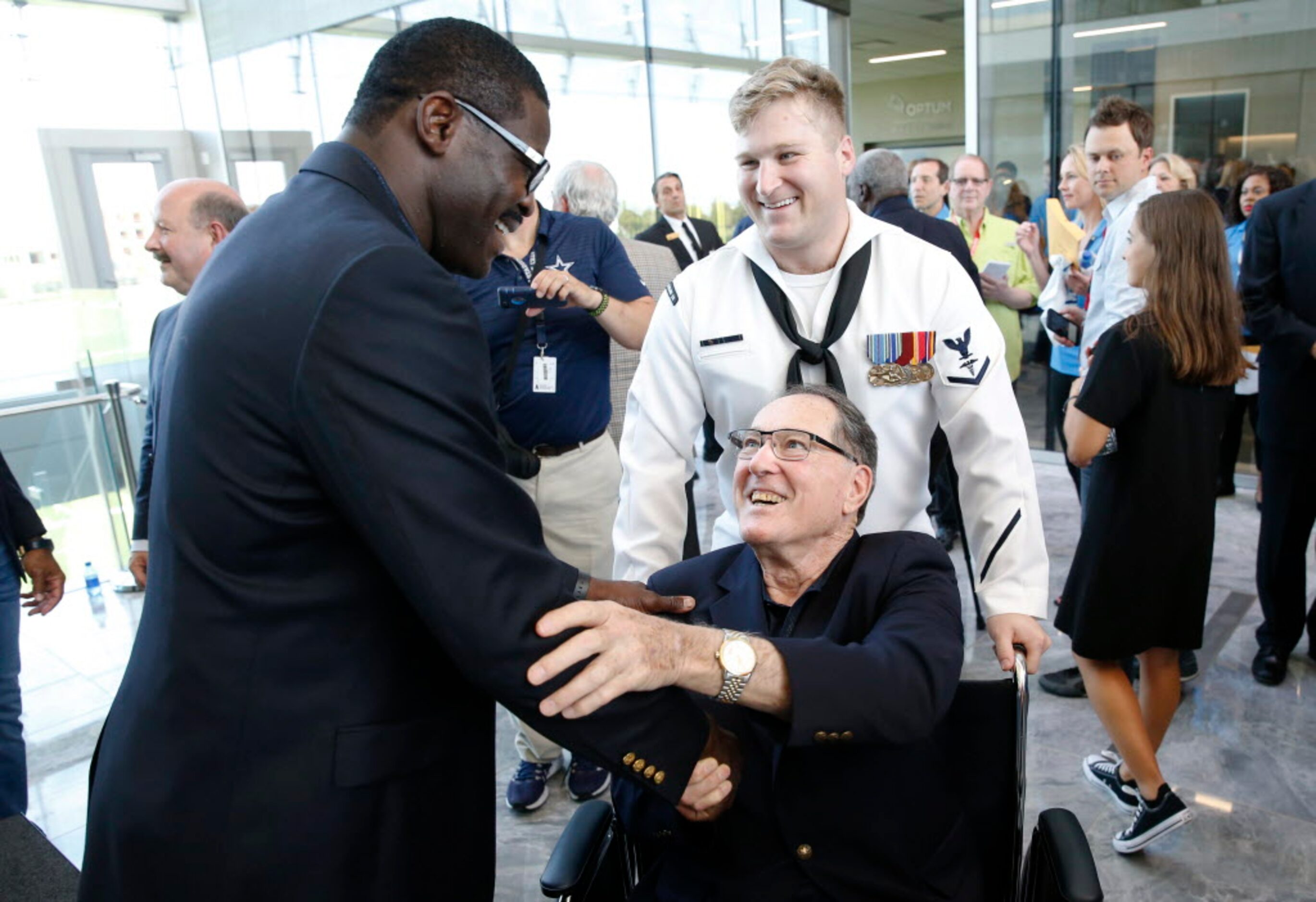 Dallas Cowboys Ring of Honor members Michael Irvin andd Chuck Howley talk to each other...