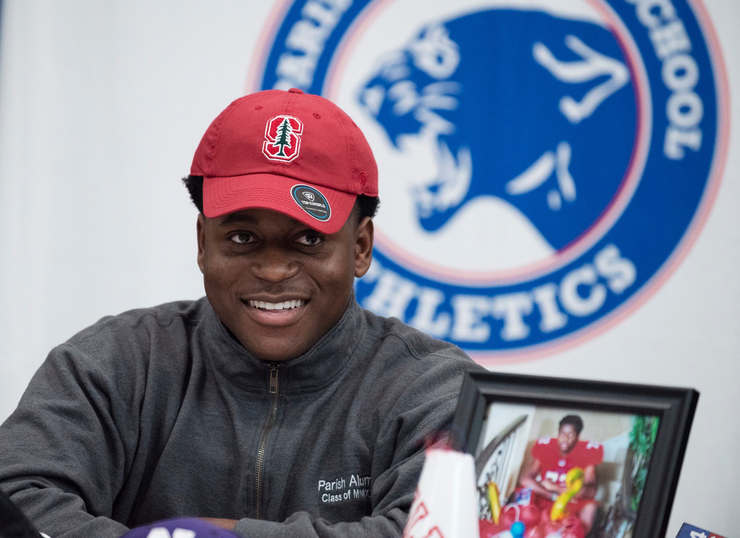 Senior Austin Uke smiles while wearing a Stanford University cap as he revealed he will be...