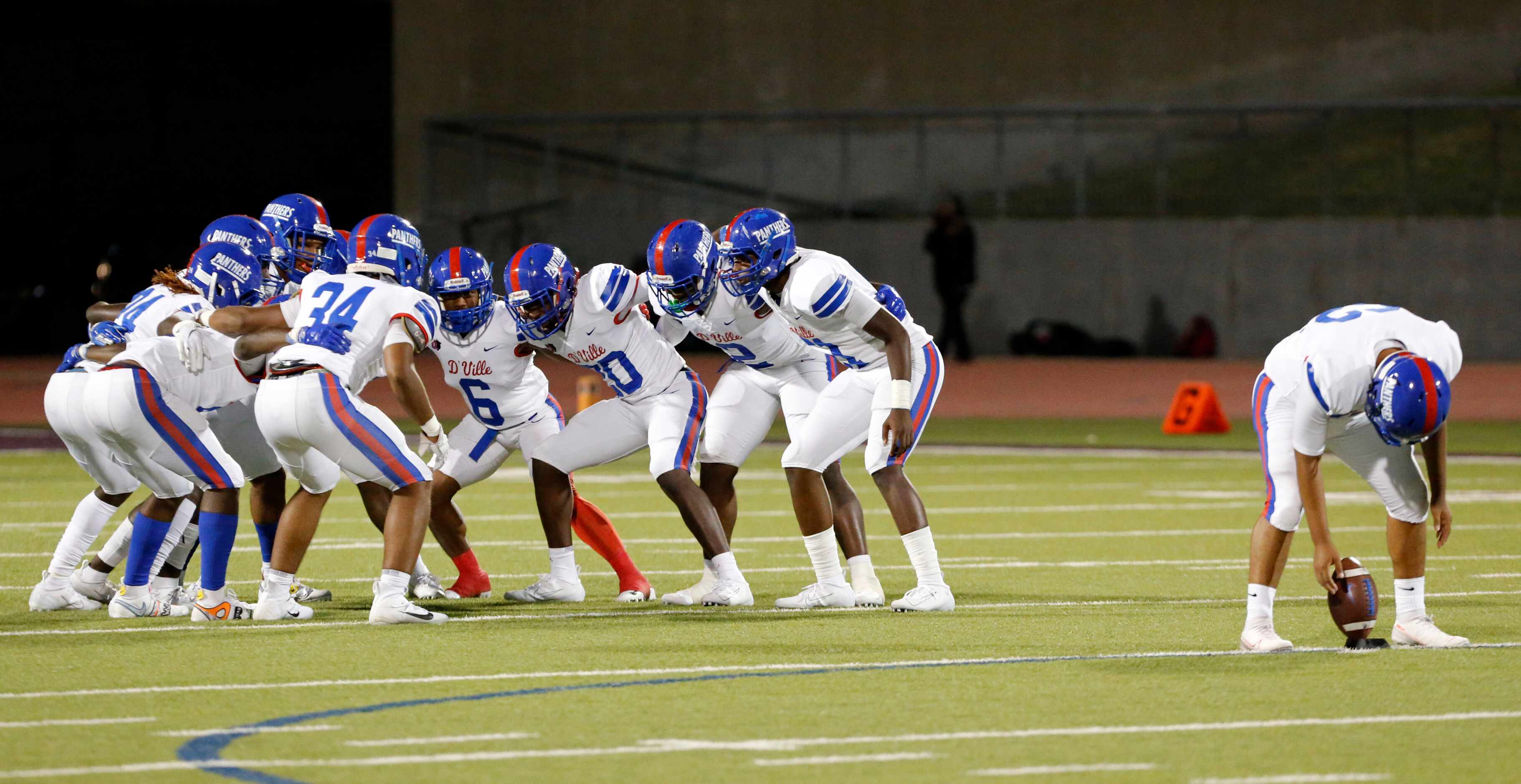 Duncanville’s kickoff team sways back and forth as the kicker tees up the football before a...