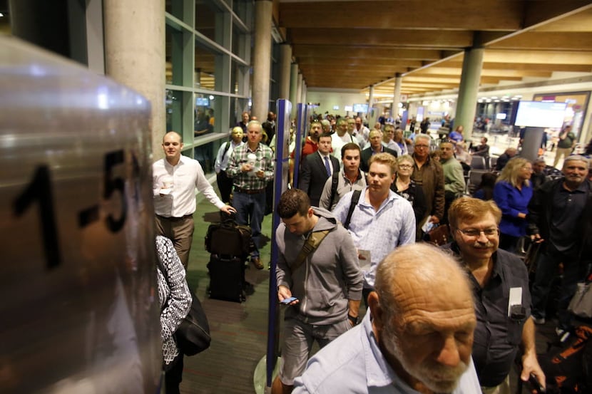 Passengers wait to board Southwest Airlines flight at Dallas Love Field. (Vernon Bryant/The...