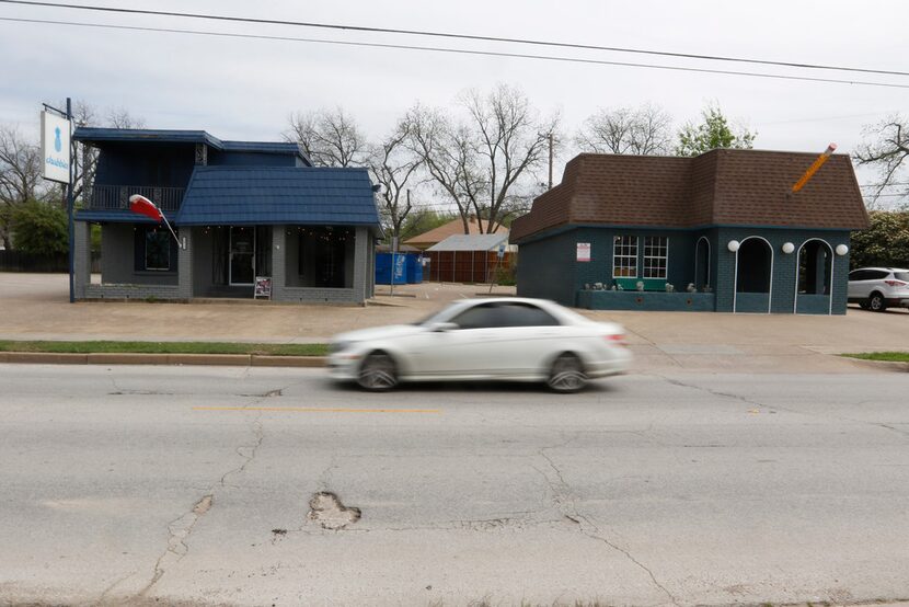 A motorist passes by two buildings on the 2000 block of North Henderson Avenue in Dallas on...