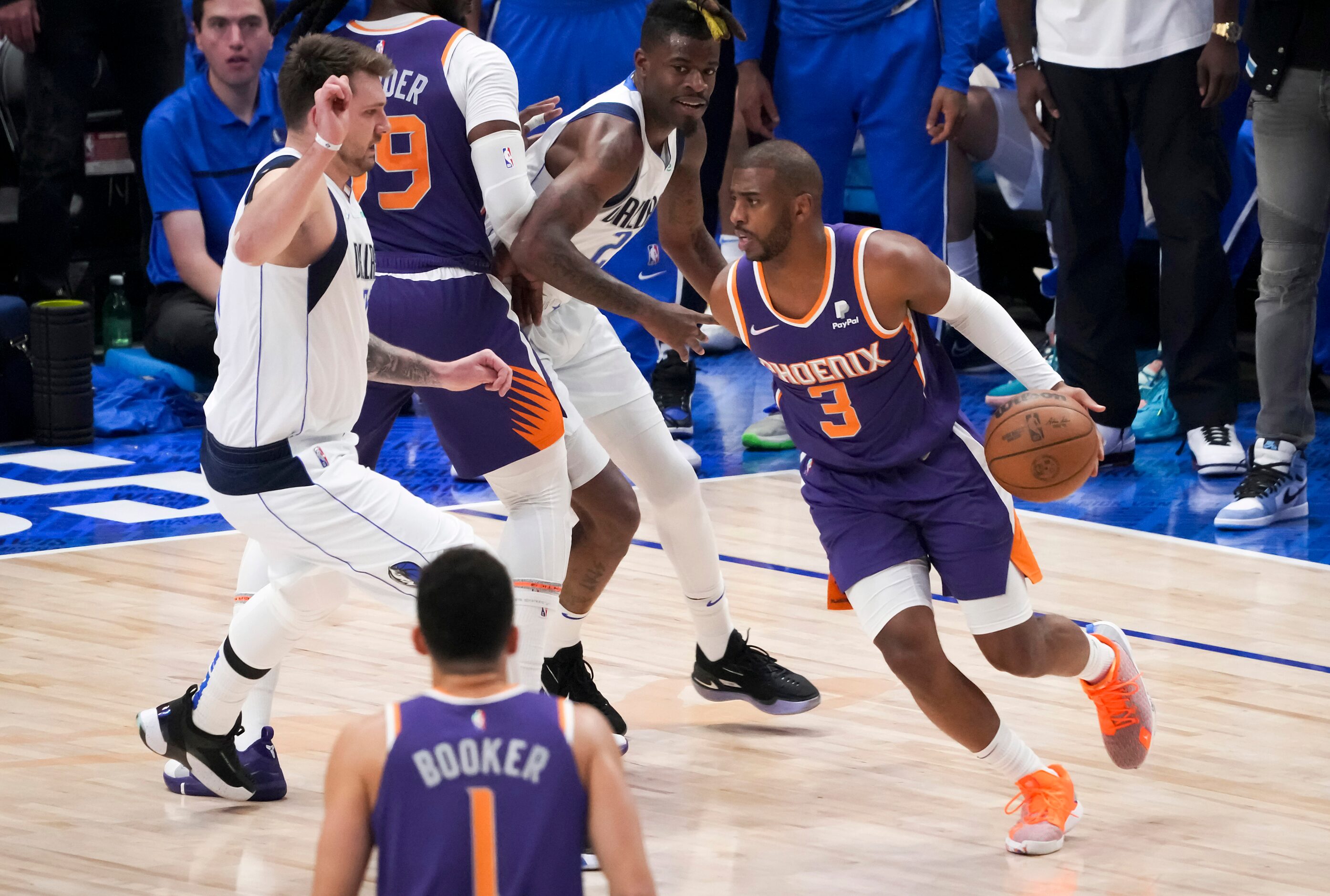 Phoenix Suns guard Chris Paul (3) tries to drive around Dallas Mavericks guard Luka Doncic...