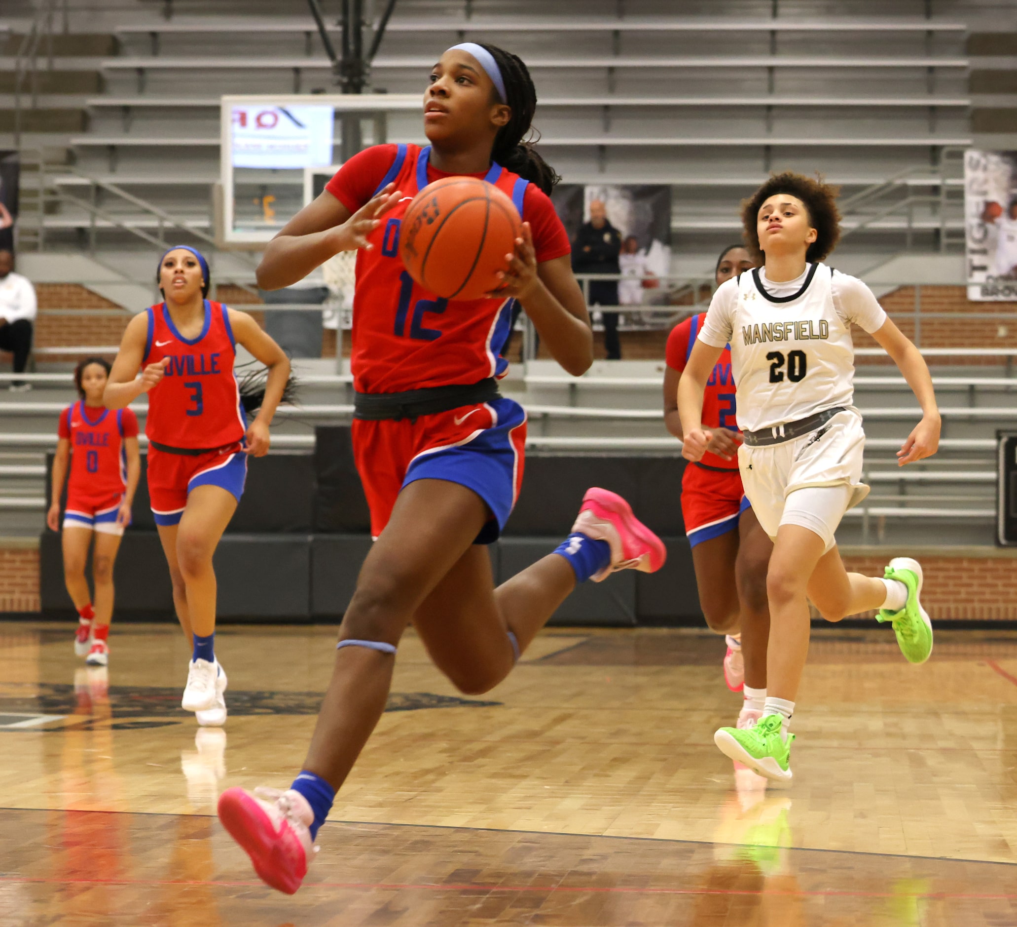 Duncanville guard Kaylinn Kemp (12) sprints to the basket for two of her first half points...