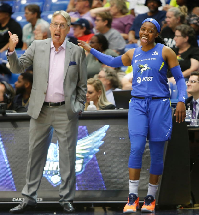 Dallas Wings guard Arike Ogunbowale (24) heads to the team bench after speaking with Wings...