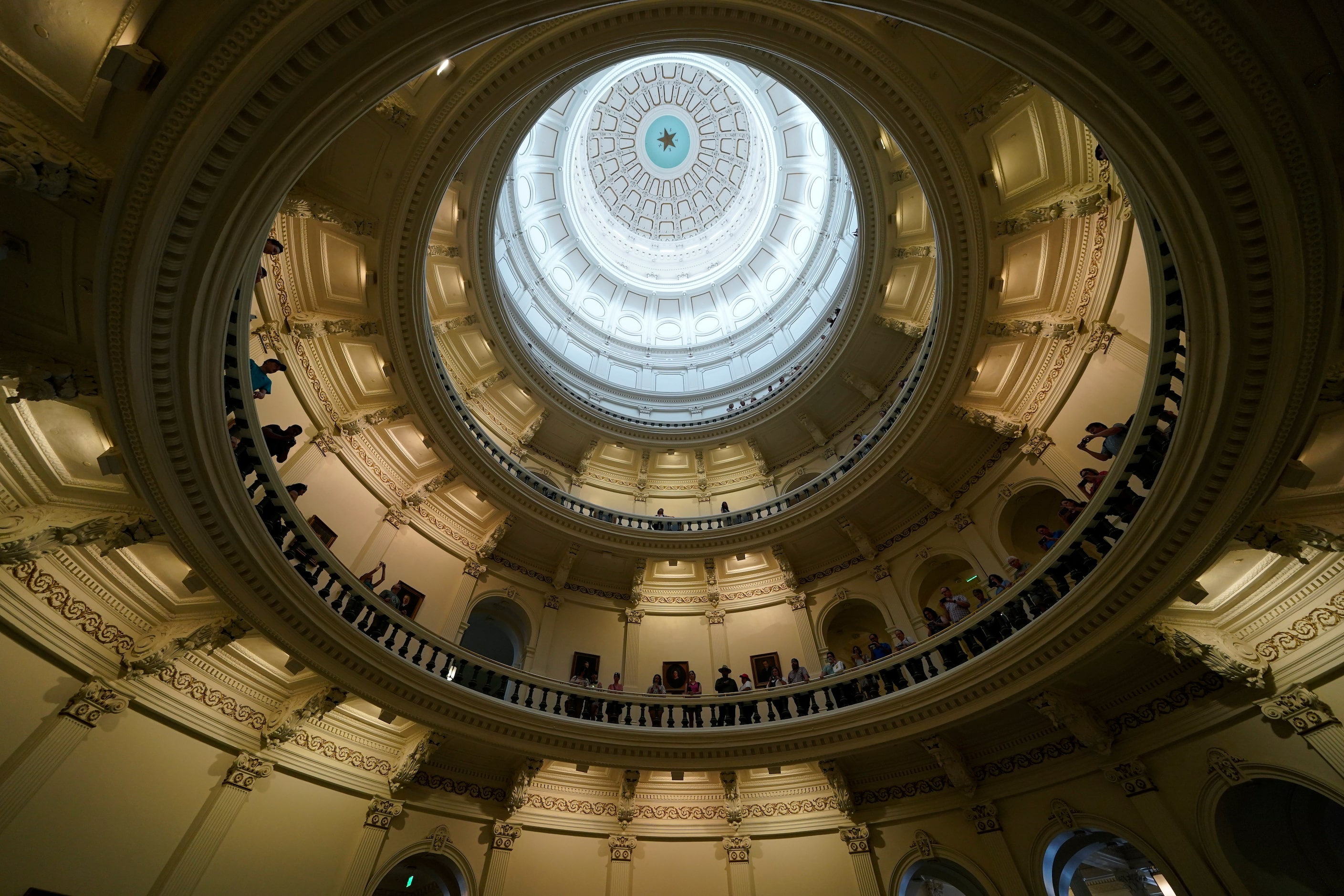 Visitors line the balcony of the rotunda before the impeachment proceedings against state...