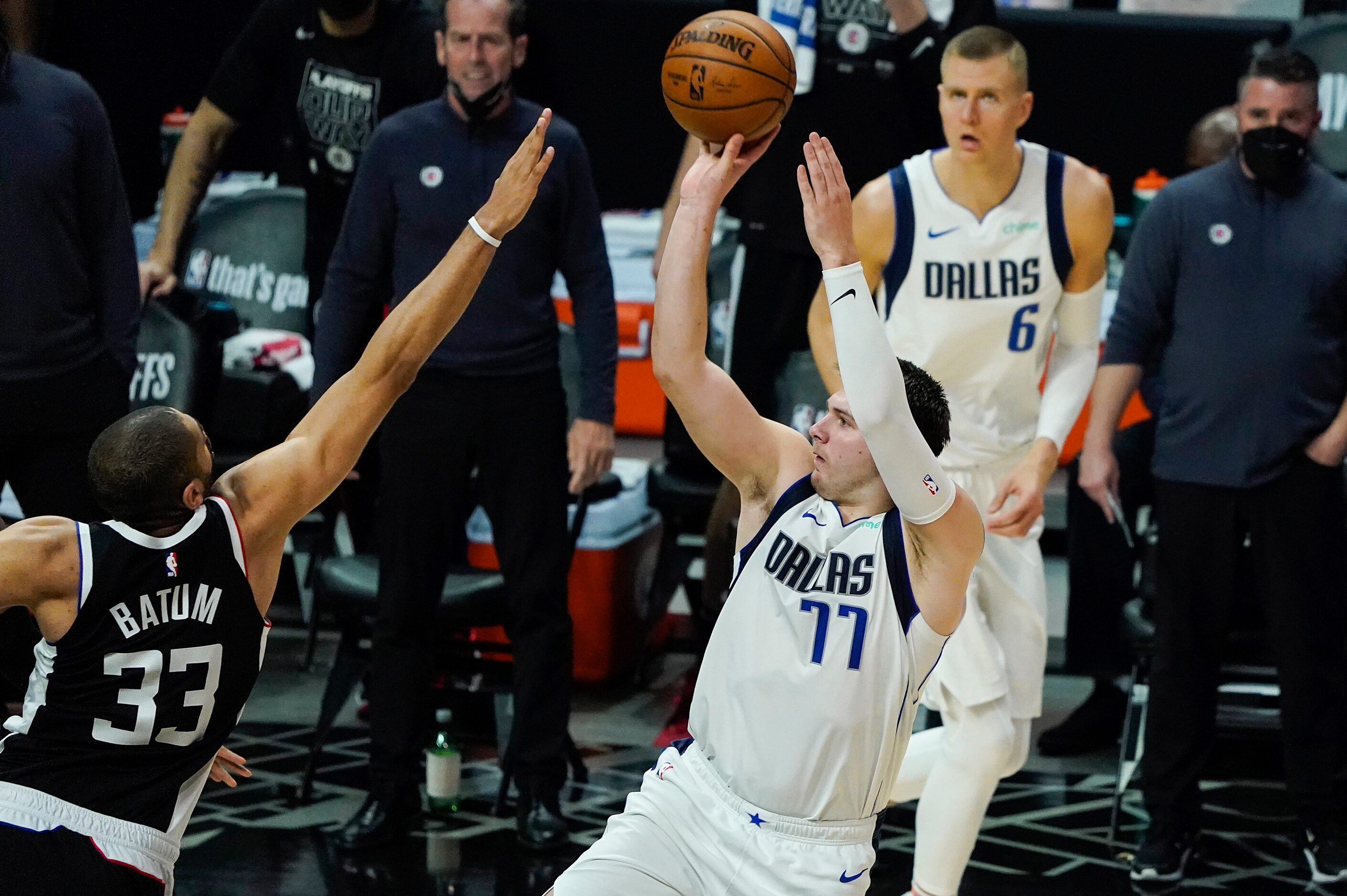 Dallas Mavericks guard Luka Doncic (77) shoots over LA Clippers forward Nicolas Batum (33)...