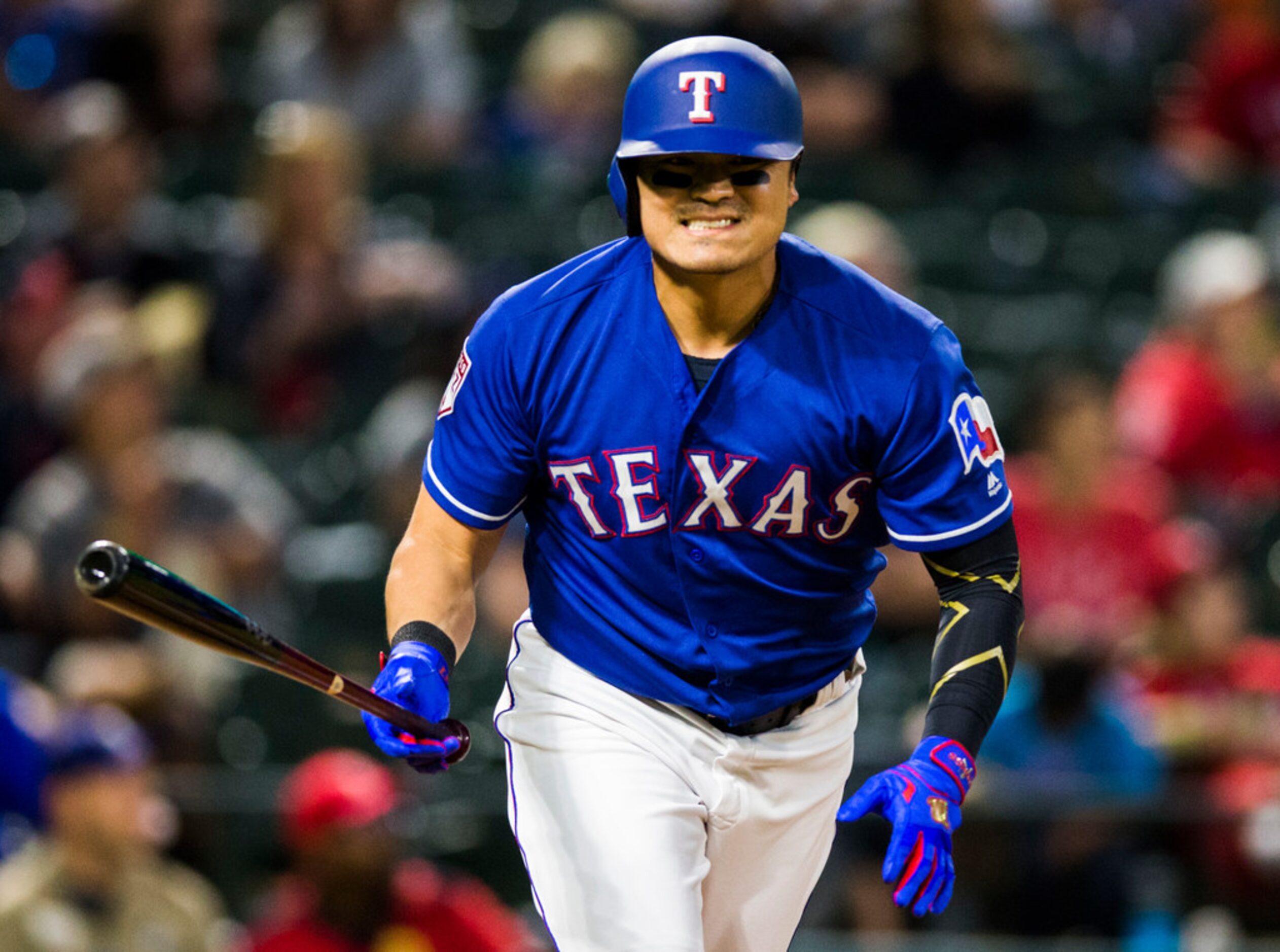 Texas Rangers designated hitter Shin-Soo Choo (17) reacts to a hit during the third inning...