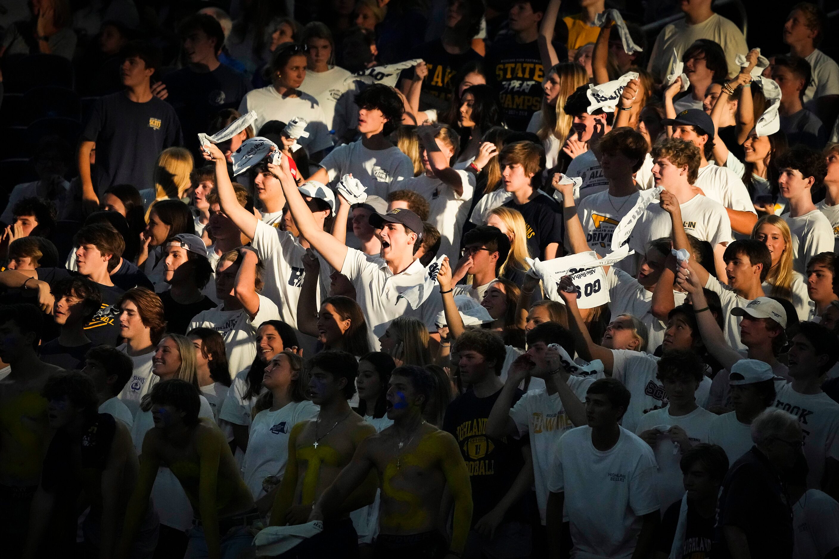 Highland Park fans cheer their team during the first half of a high school football game...