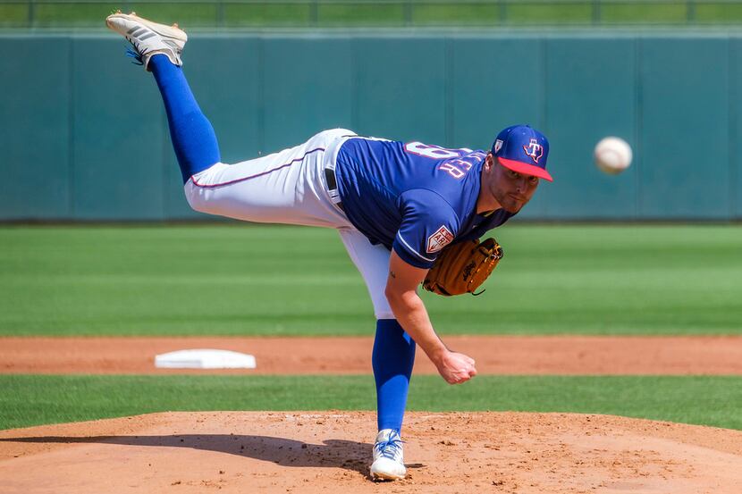 Texas Rangers pitcher Shelby Miller pitches during the first inning of a spring training...